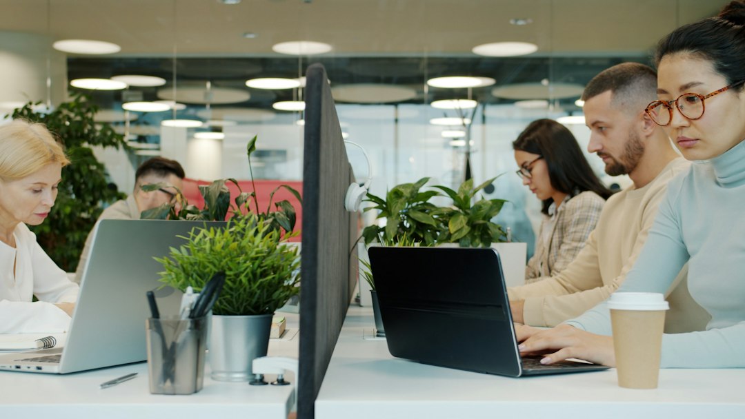 Professional technology team working together in a modern office